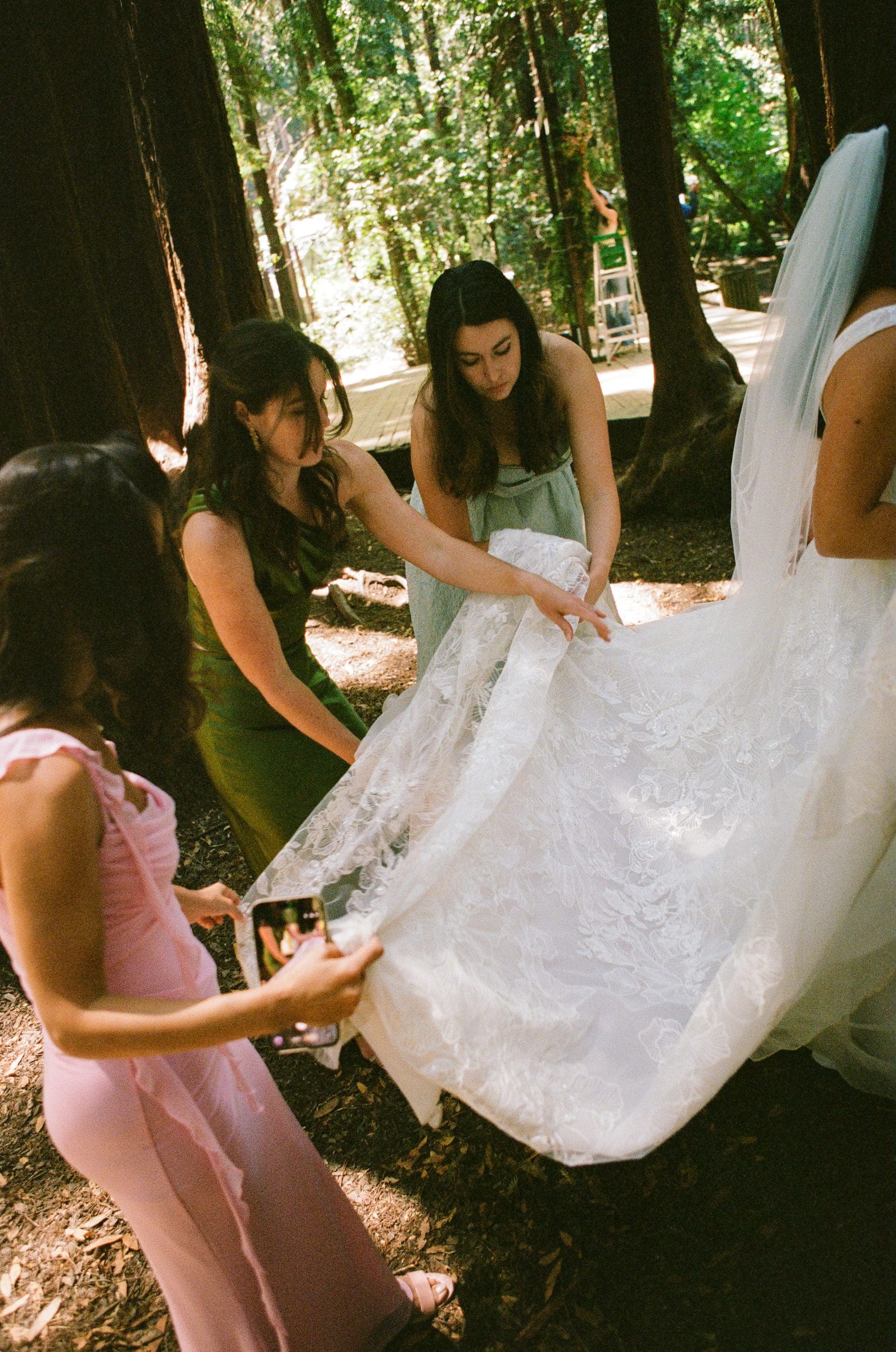 Bridesmaids fluffing Lala's dress, on film