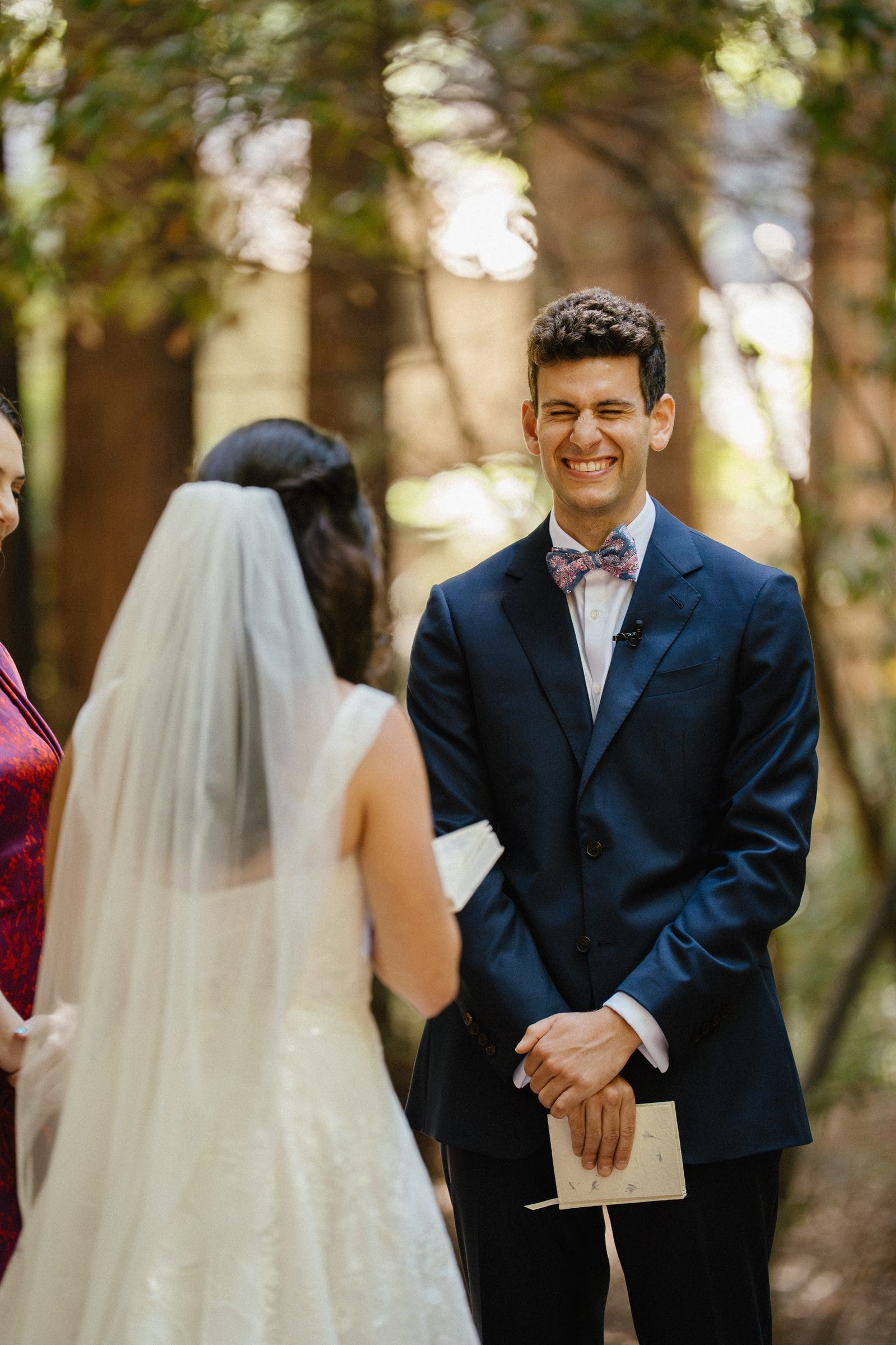 Adam smiling at Lala during the ceremony