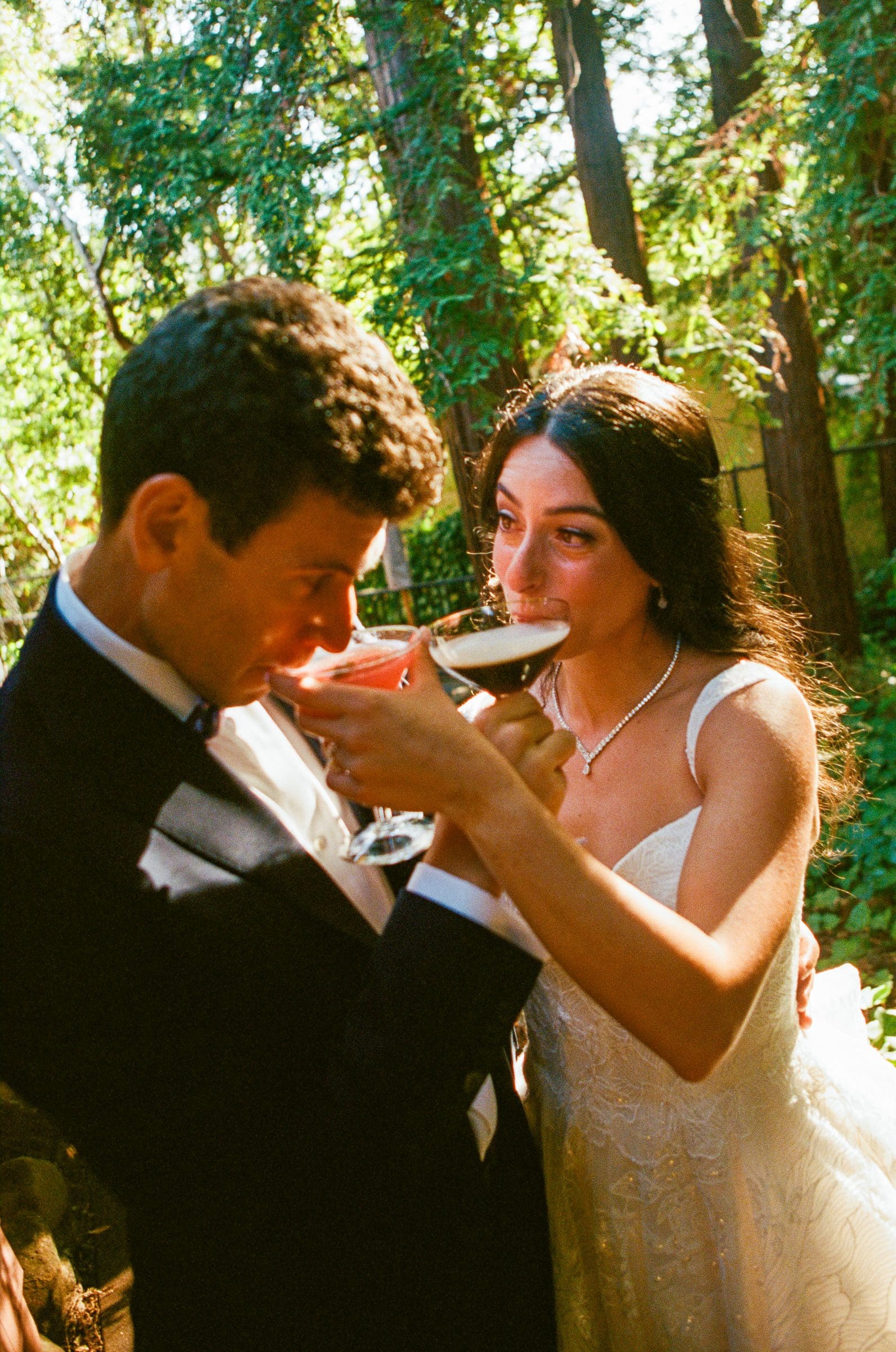 Adam and Lala sharing a drink, on film