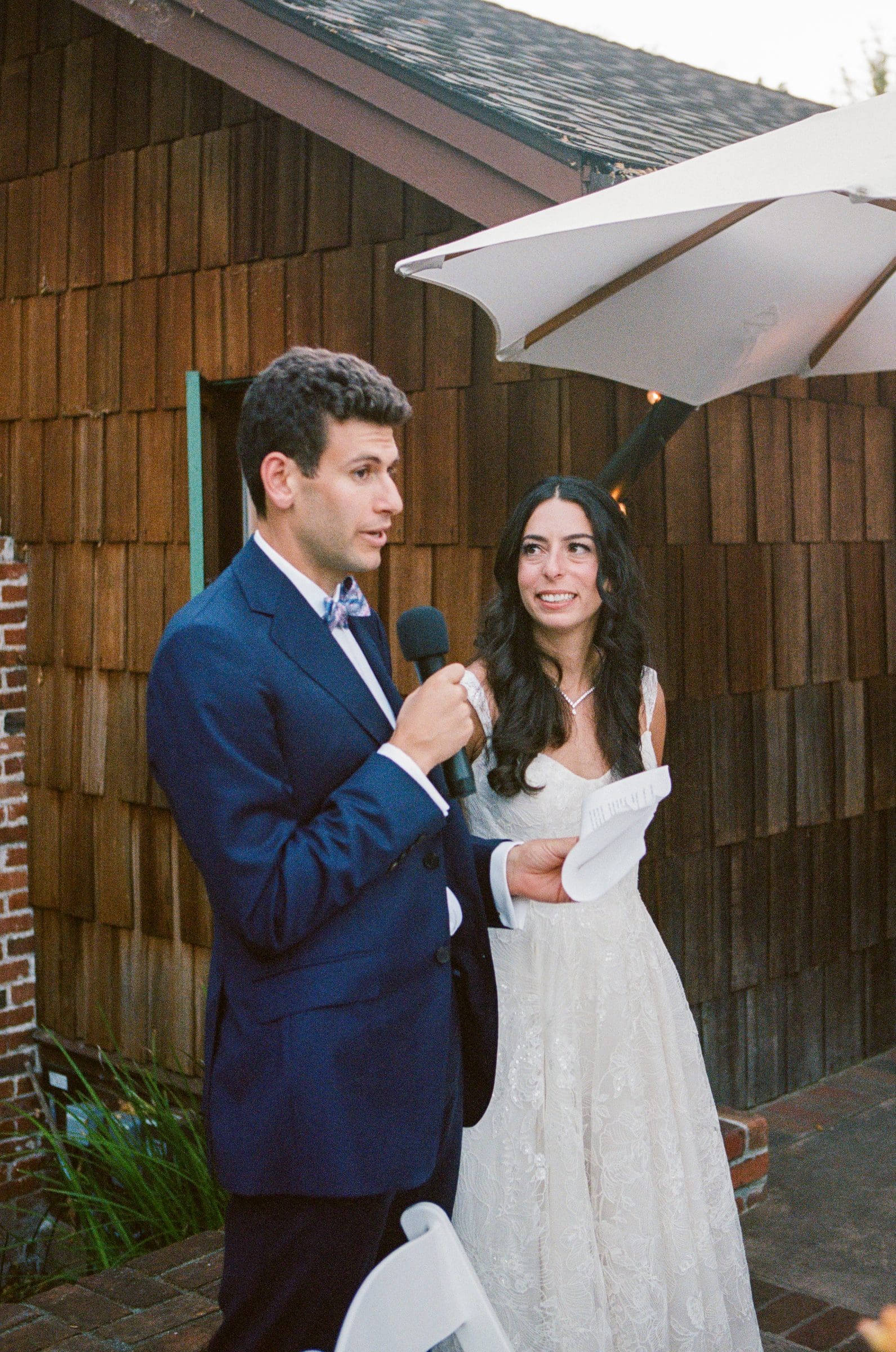 Adam and Lala giving a toast, on film
