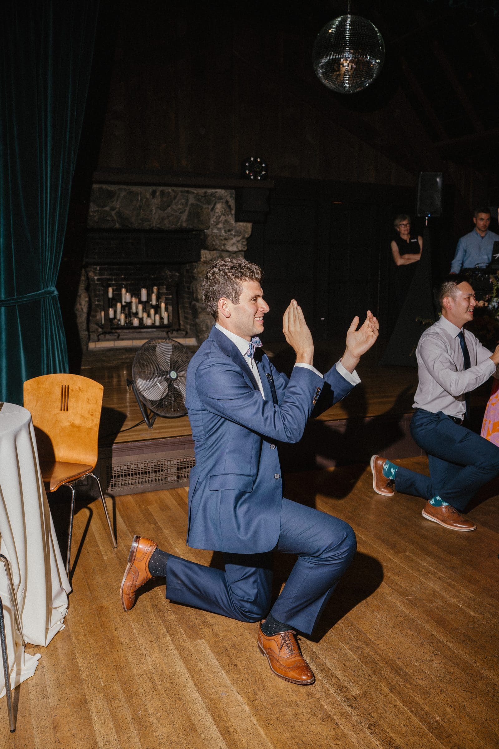 Adam on one knee on the dance floor