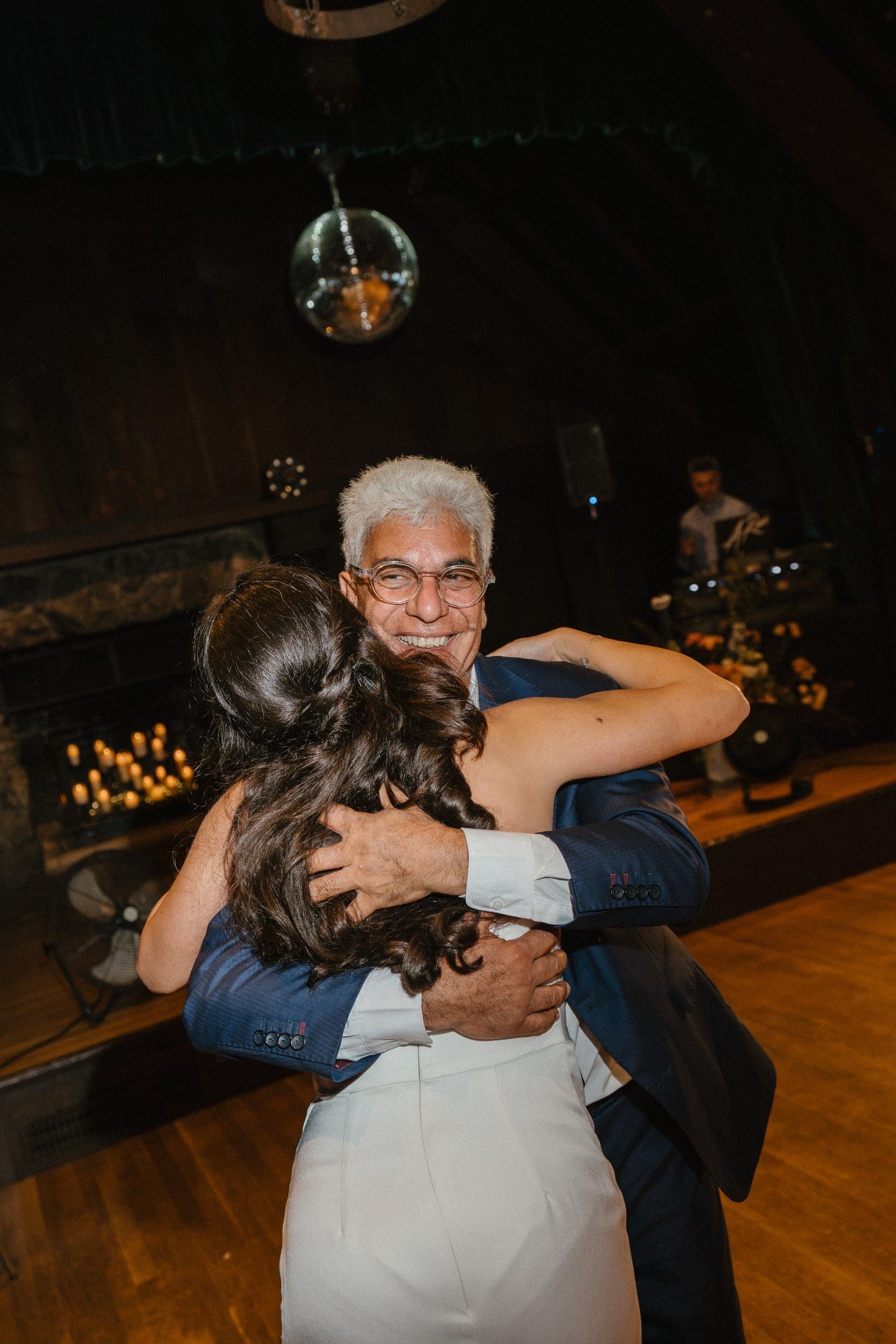 Lala hugging a guest on the dance floor