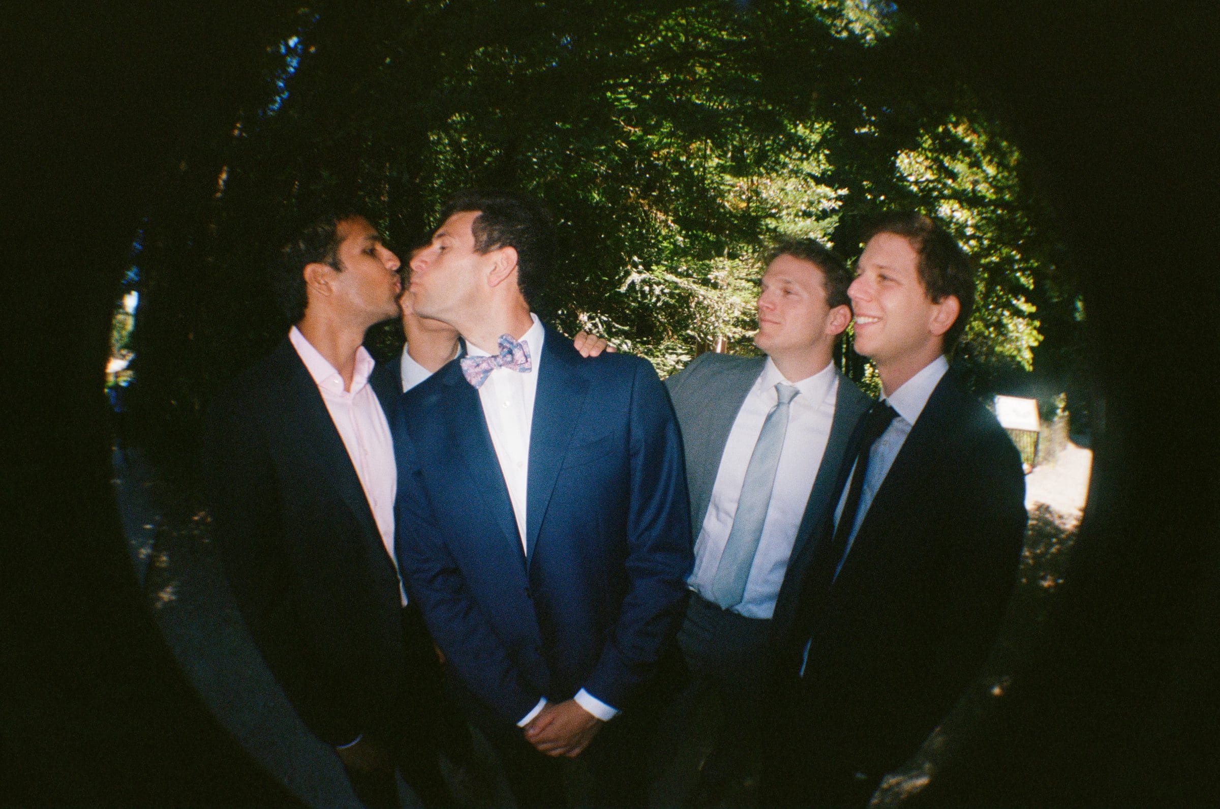 Adam with his groomsmen, fisheye on film