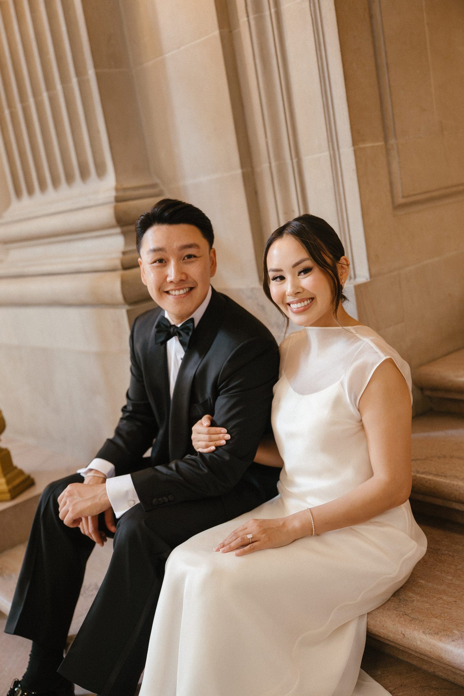 David and Michelle sitting on the marble steps at City Hall