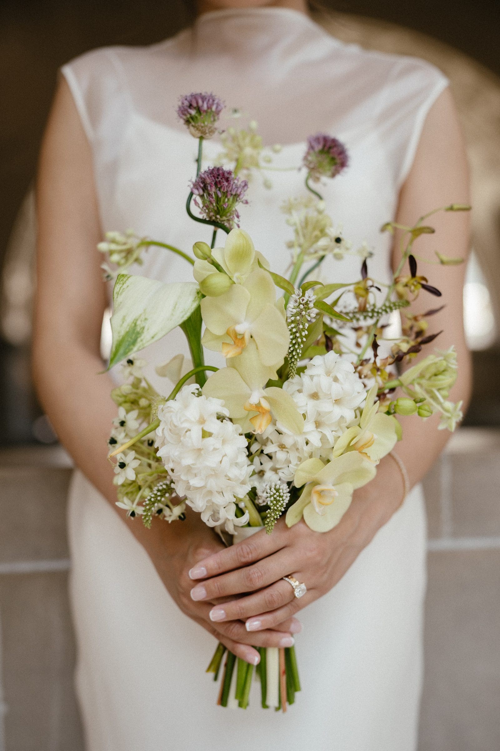 Michelle's bouquet of white and purple flowers