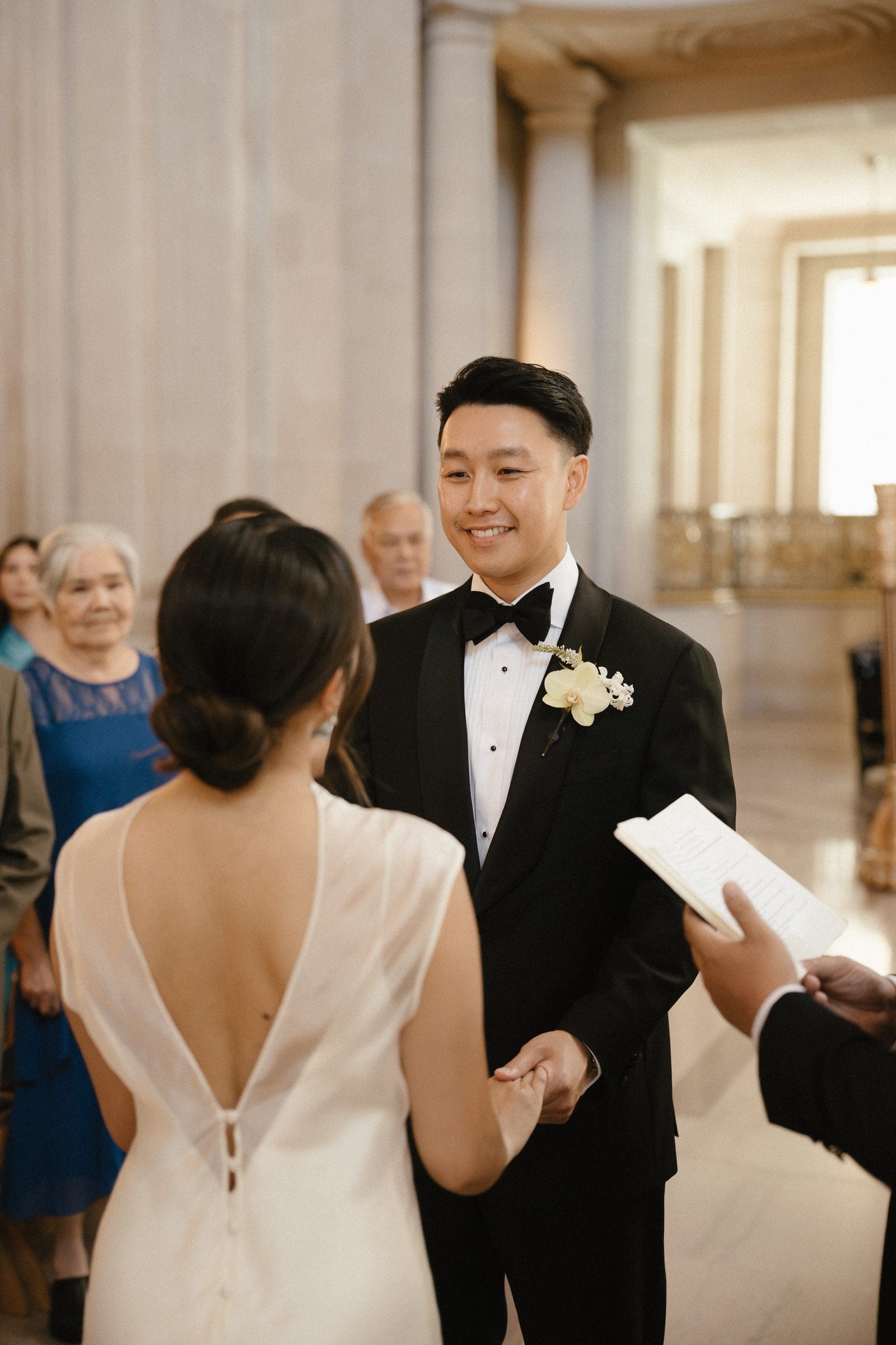 David reading his vows to Michelle at the Mayor's Balcony