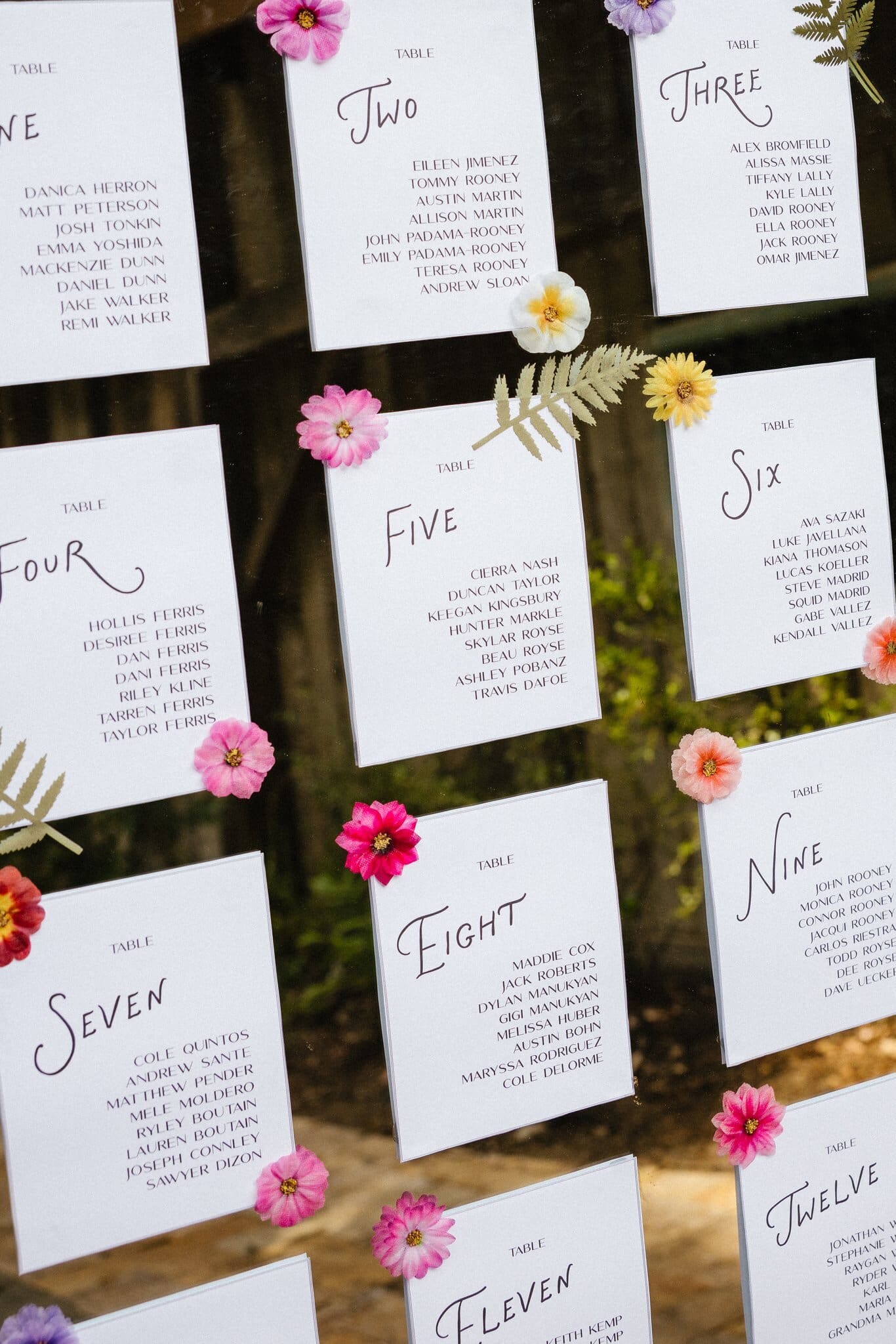 Seating chart cards decorated with fresh flowers