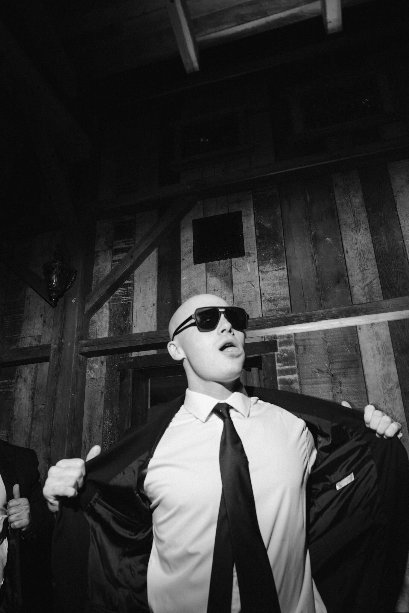 Guest dancing in sunglasses, black and white
