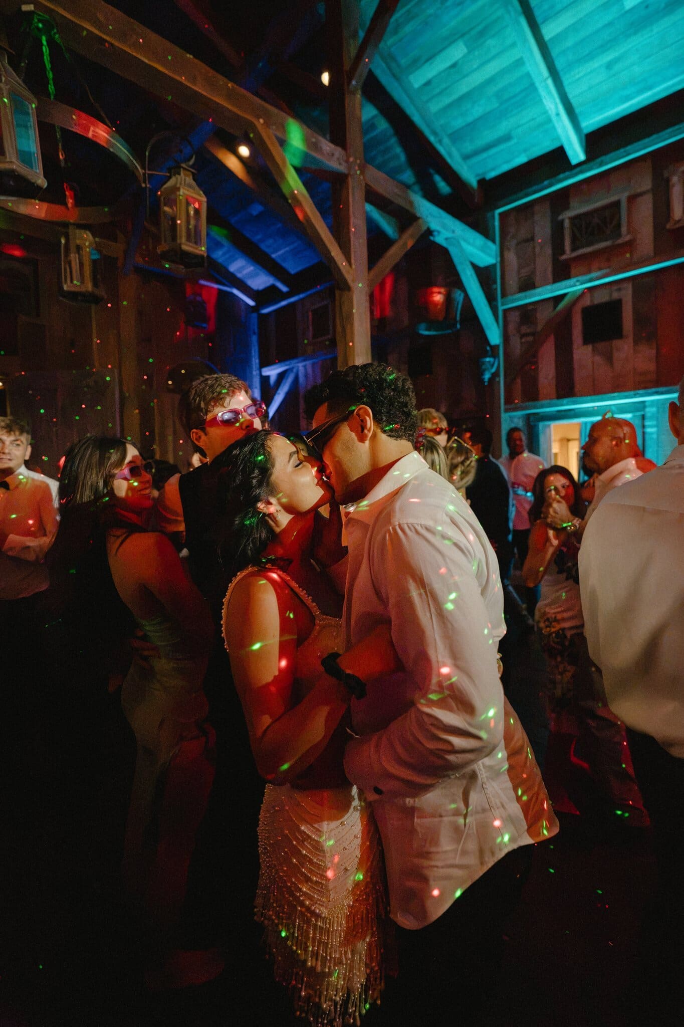 Sofia and Devin kissing on the crowded dance floor