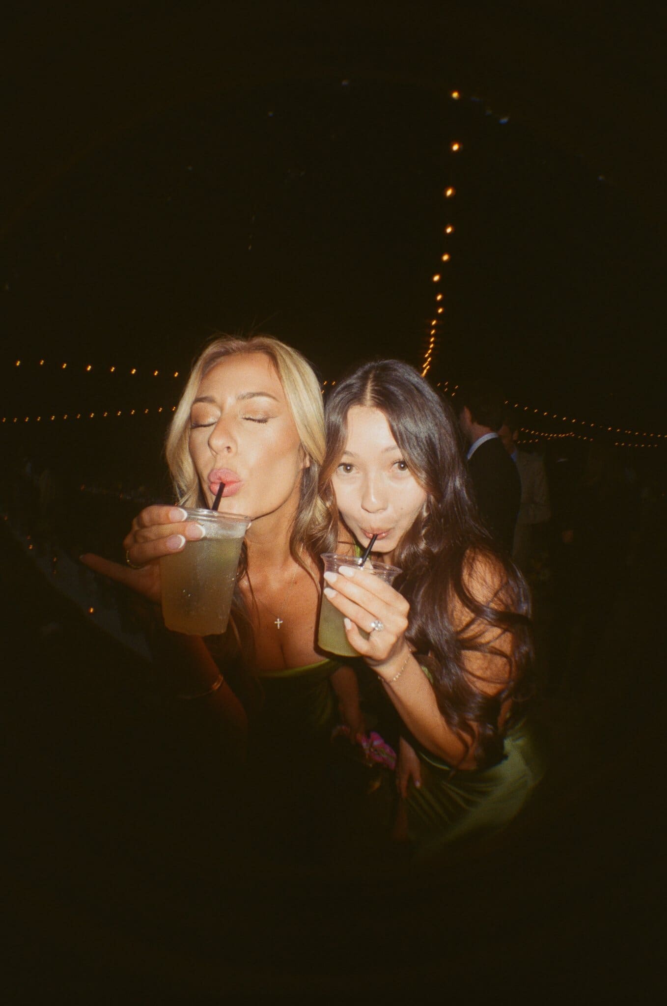 Friends sharing drinks in flash, on film