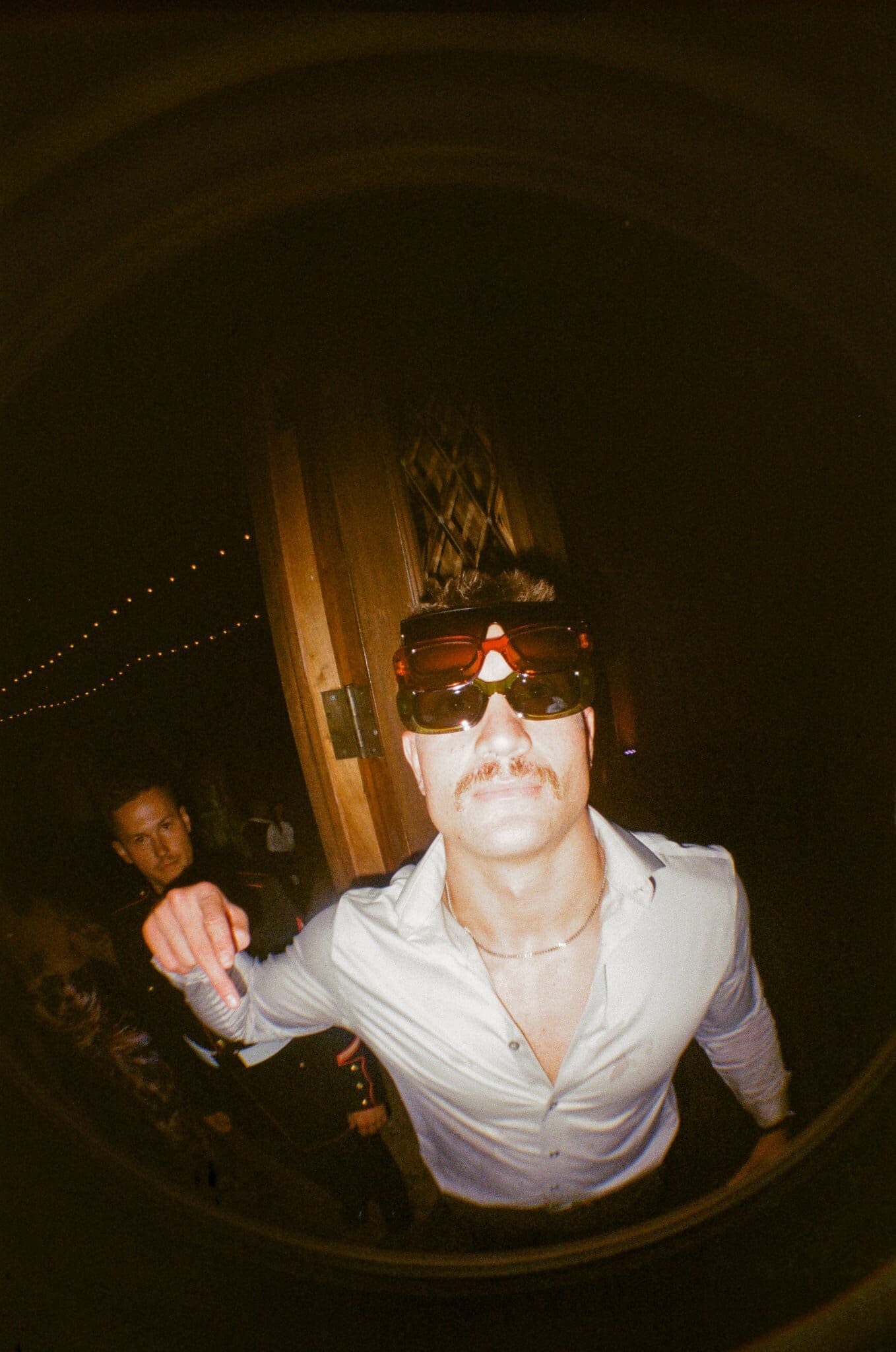 Guest dancing in sunglasses, flash on film