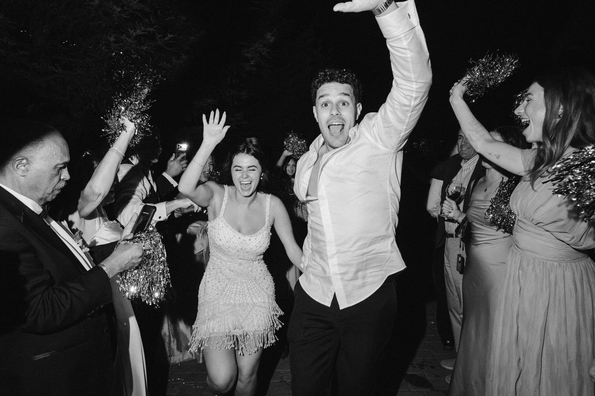Sofia and Devin dancing in the crowd, black and white