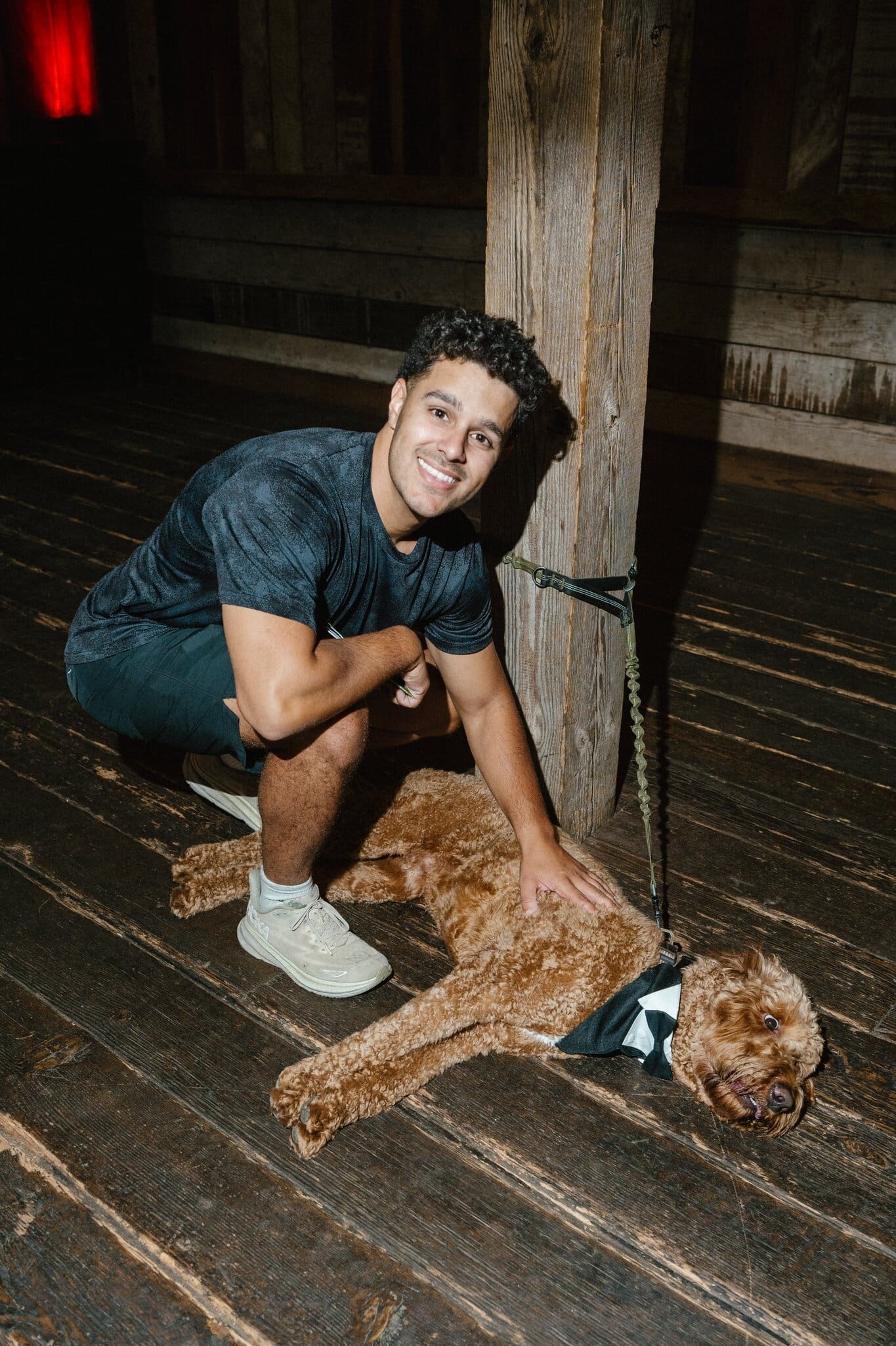 Groomsman greeting the pup before the ceremony