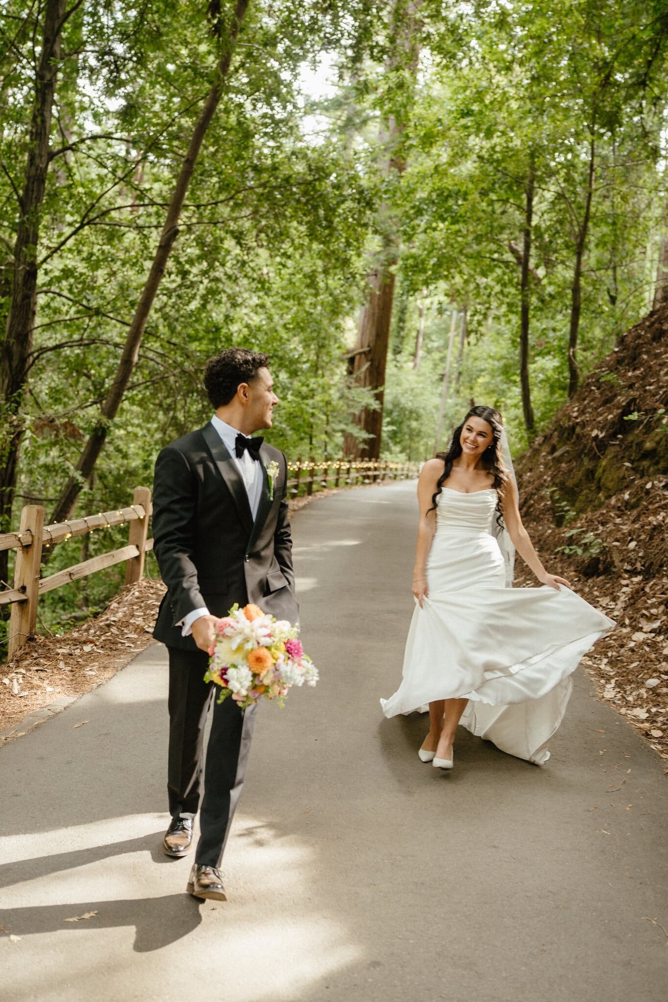 Sofia and Devin walking along a forest road at Waterfall Lodge & Retreat