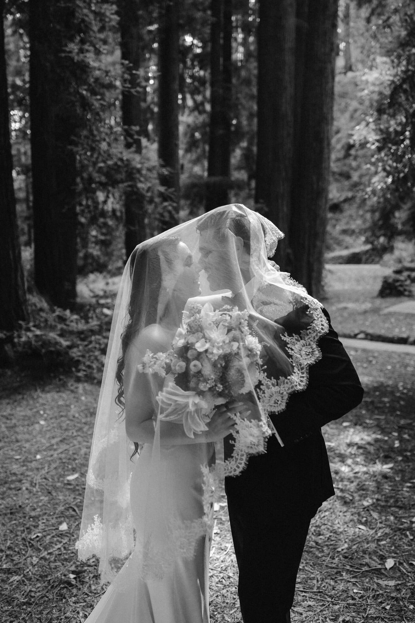 Sofia and Devin under the veil, black and white