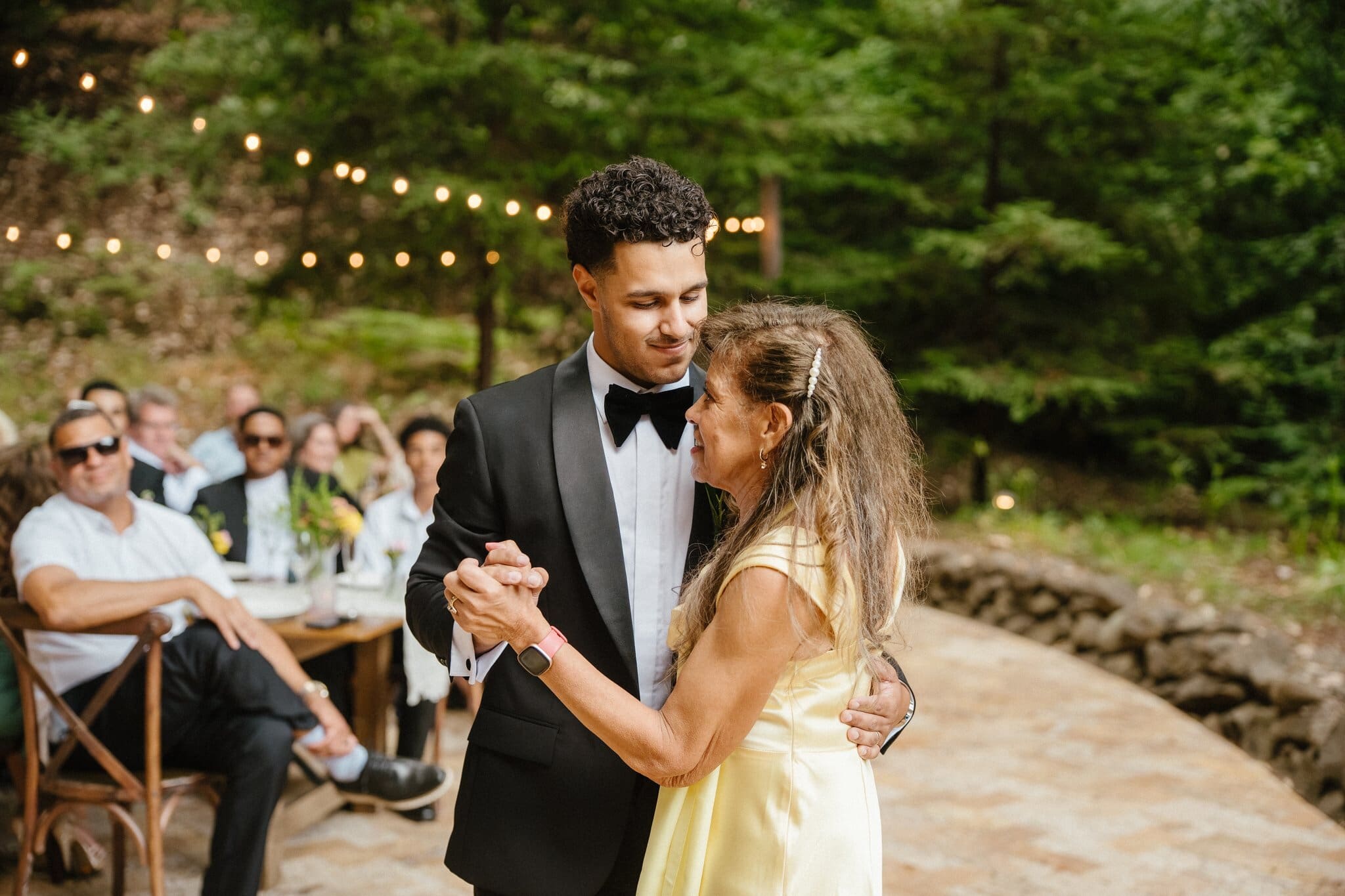 Devin sharing a dance with a guest at the reception