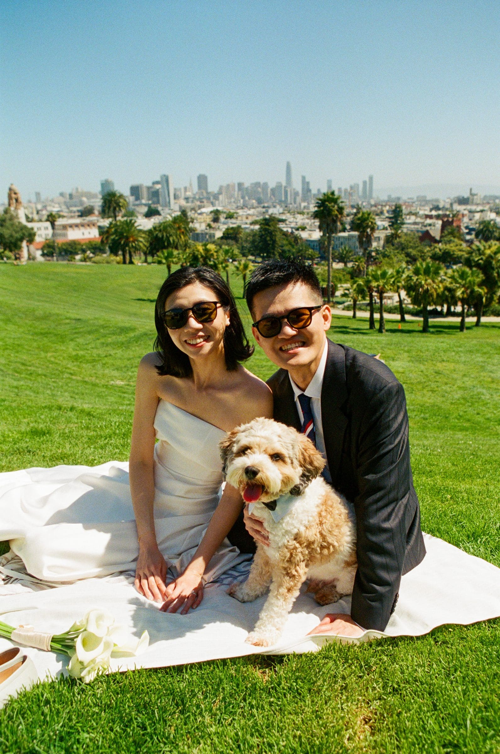 Hsiang and Ting having a picnic with their dog in Dolores Park, on film