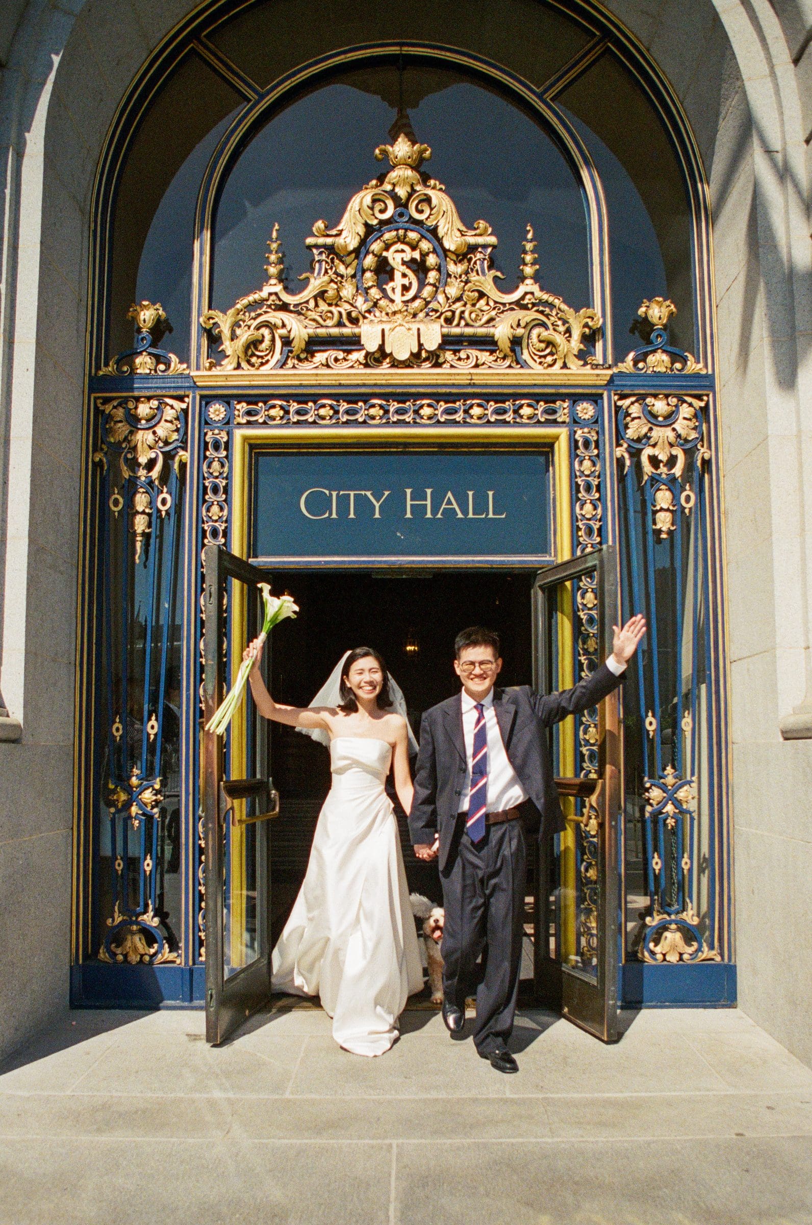 Ting and Hsiang cheering in the City Hall doorway, on film