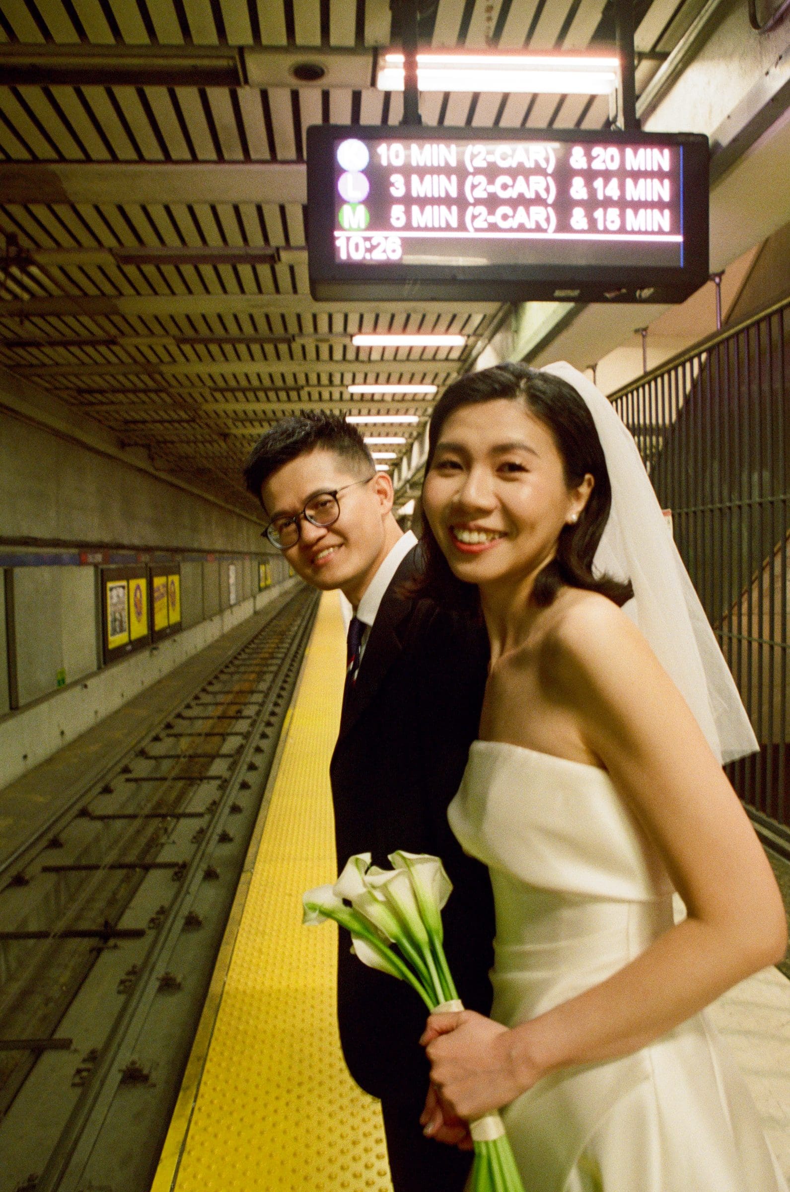 Hsiang and Ting waiting on the Muni platform, on film