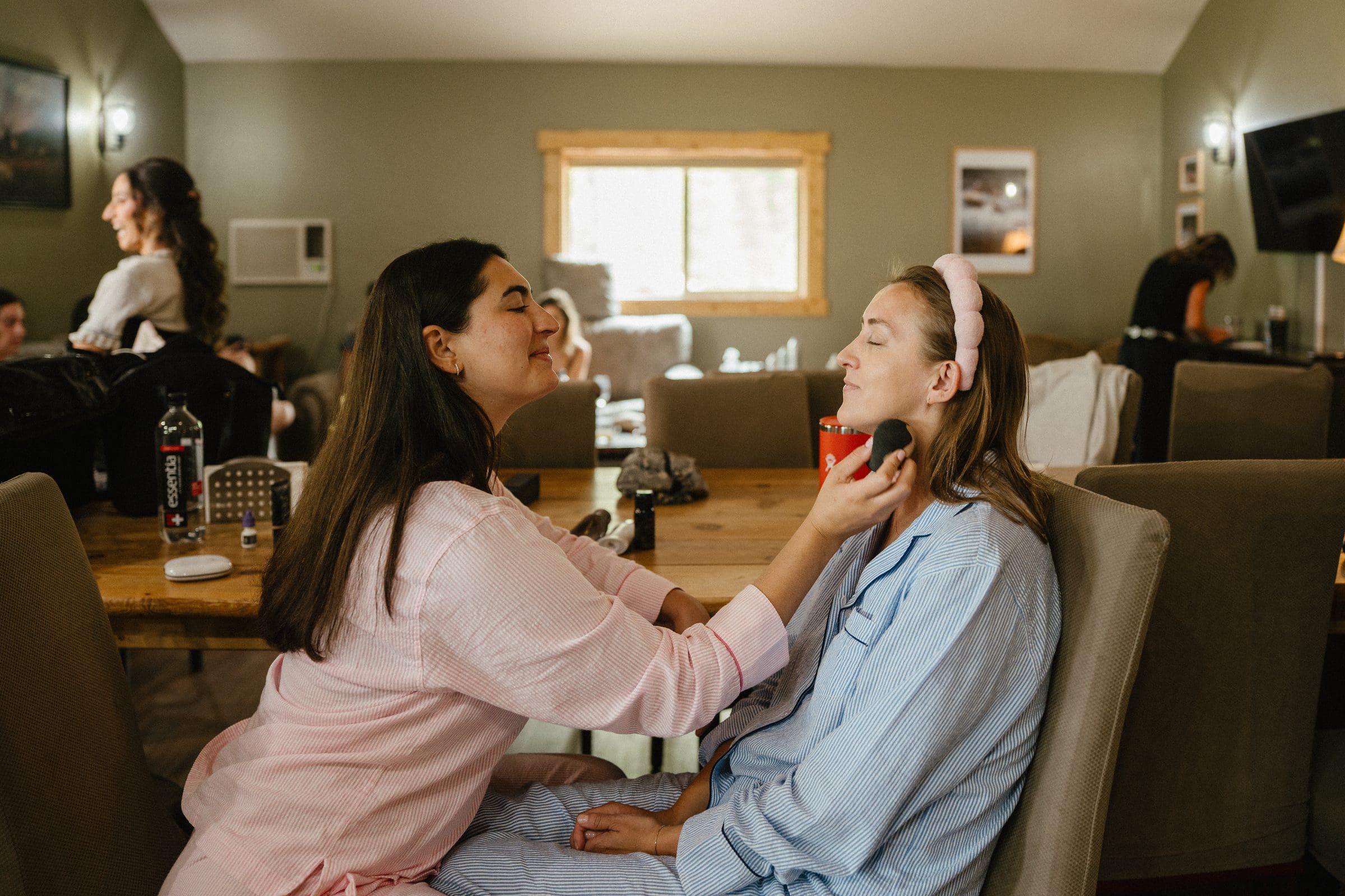 Isabelle getting her makeup done the morning of the wedding
