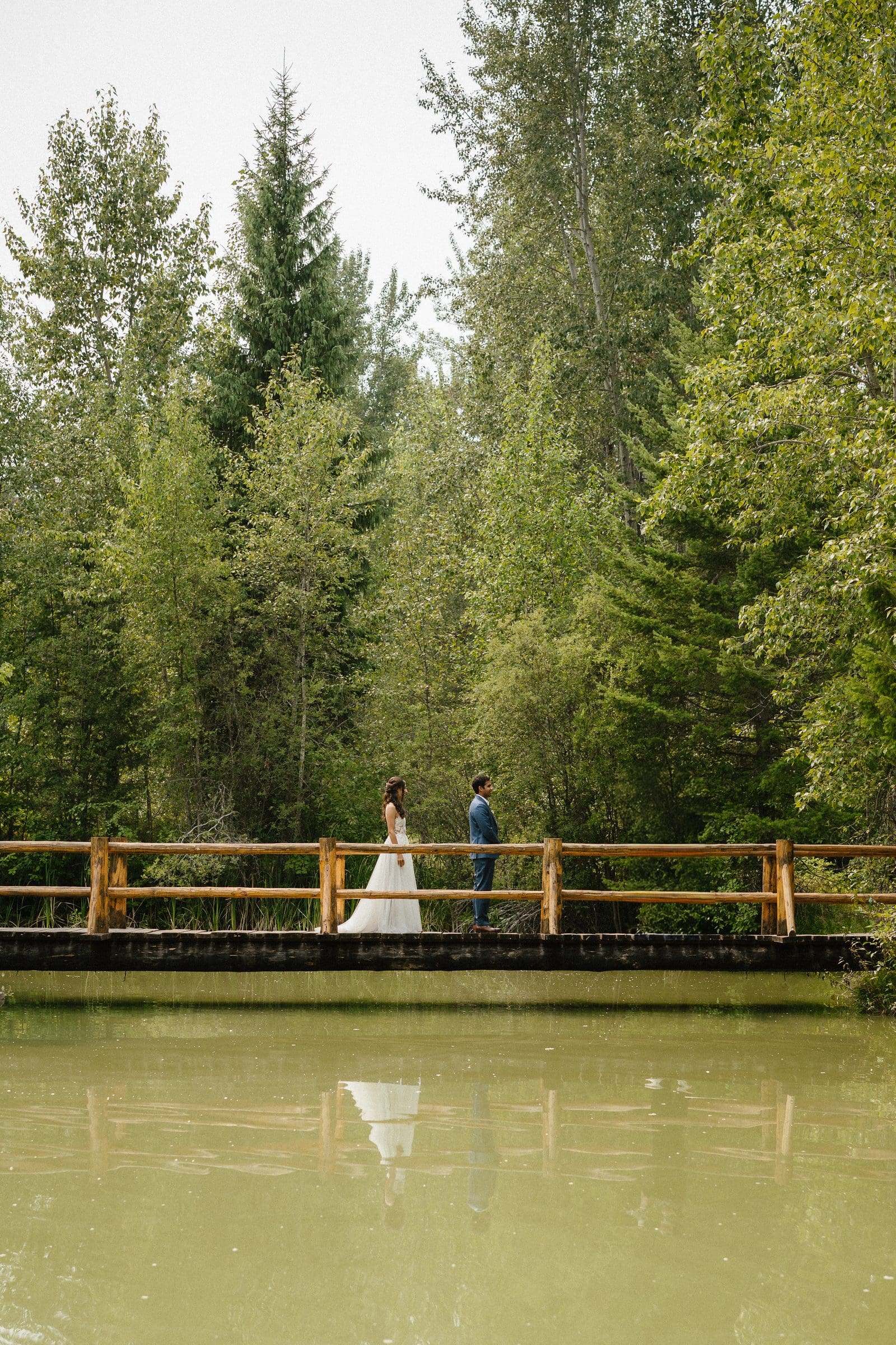 Raj and Isabelle's first look on a wooden bridge in the forest