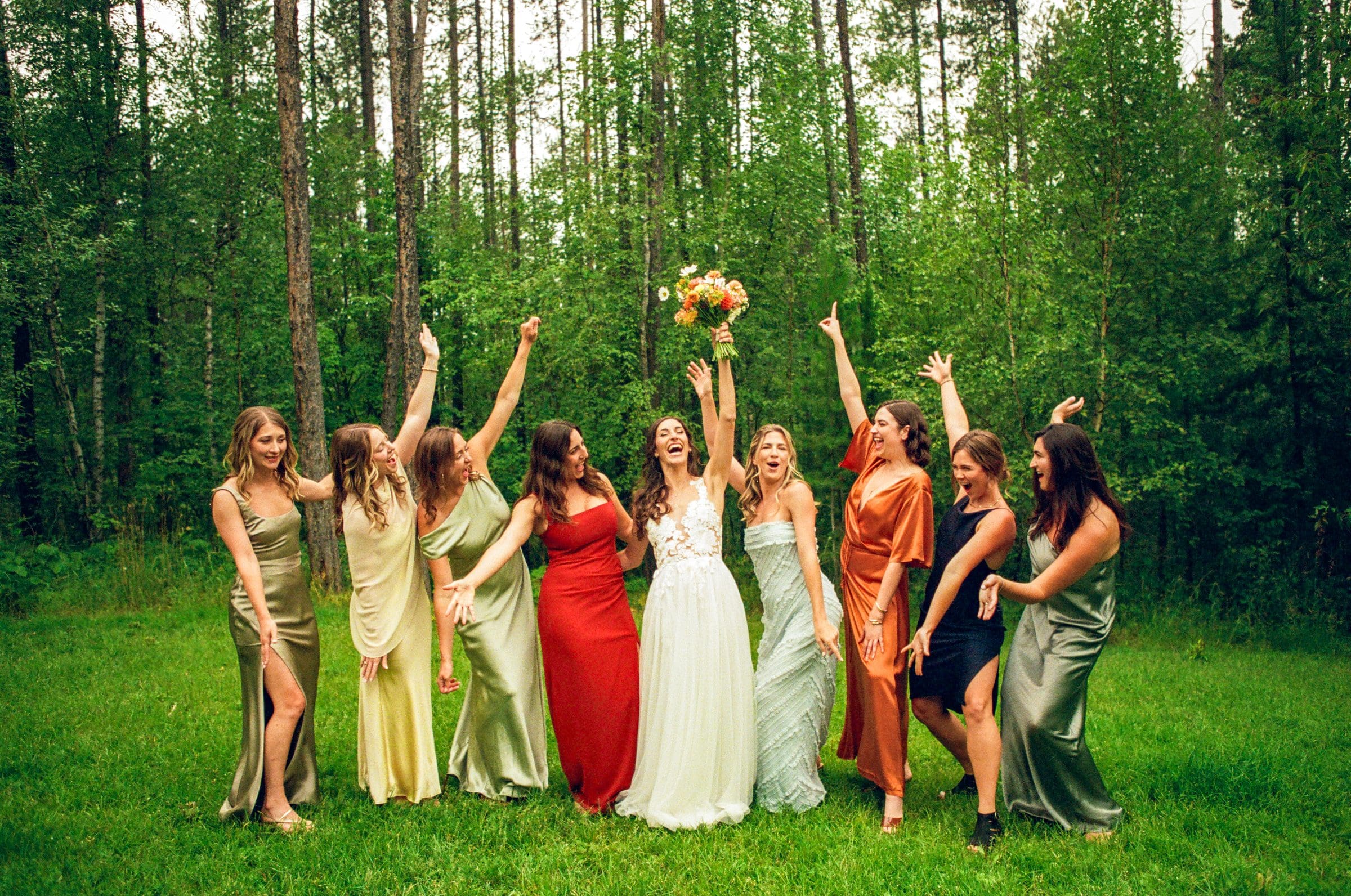 Isabelle and her bridesmaids cheering in the forest, on film
