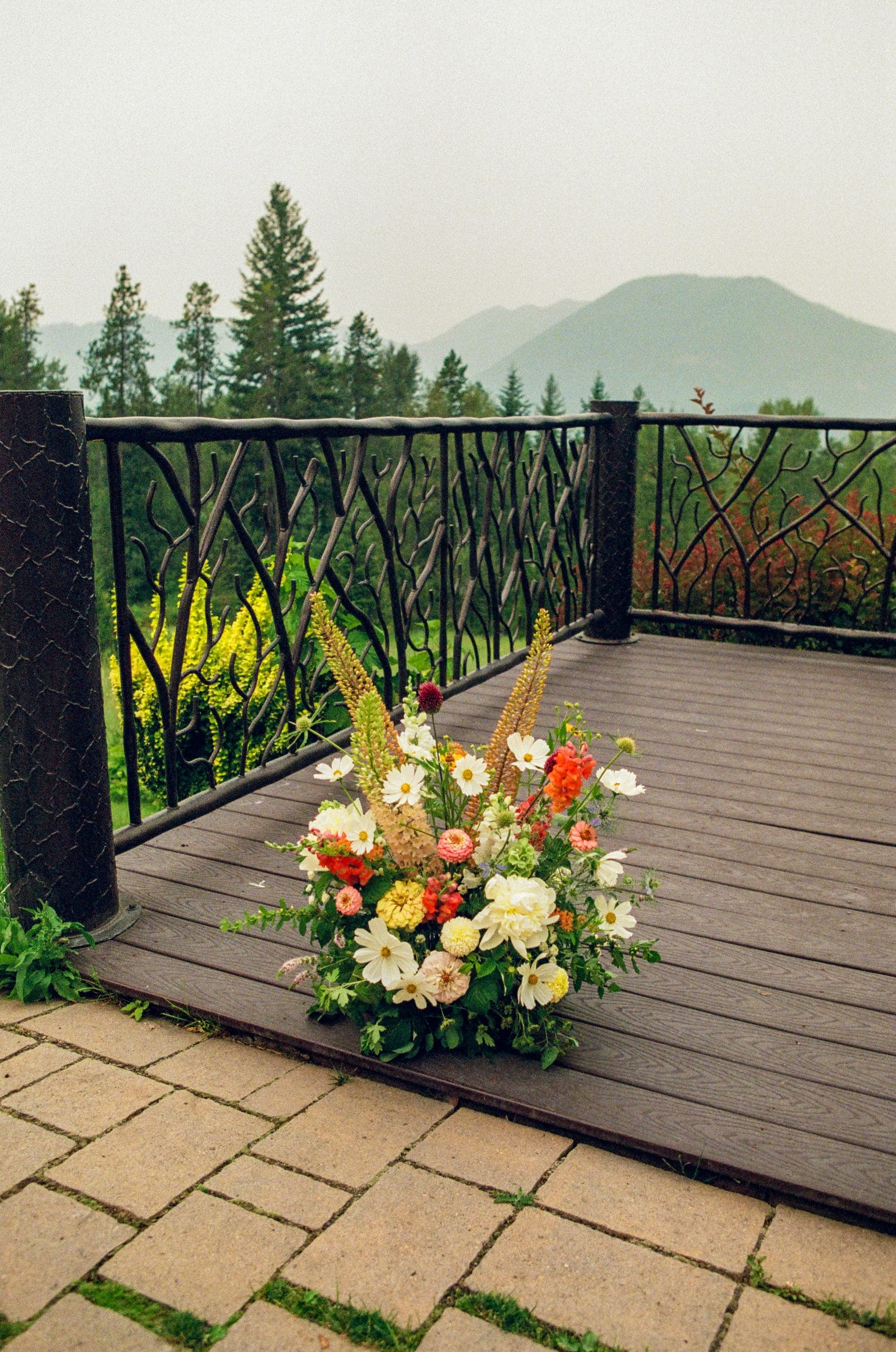 Ceremony florals on the deck above Lake McDonald, on film