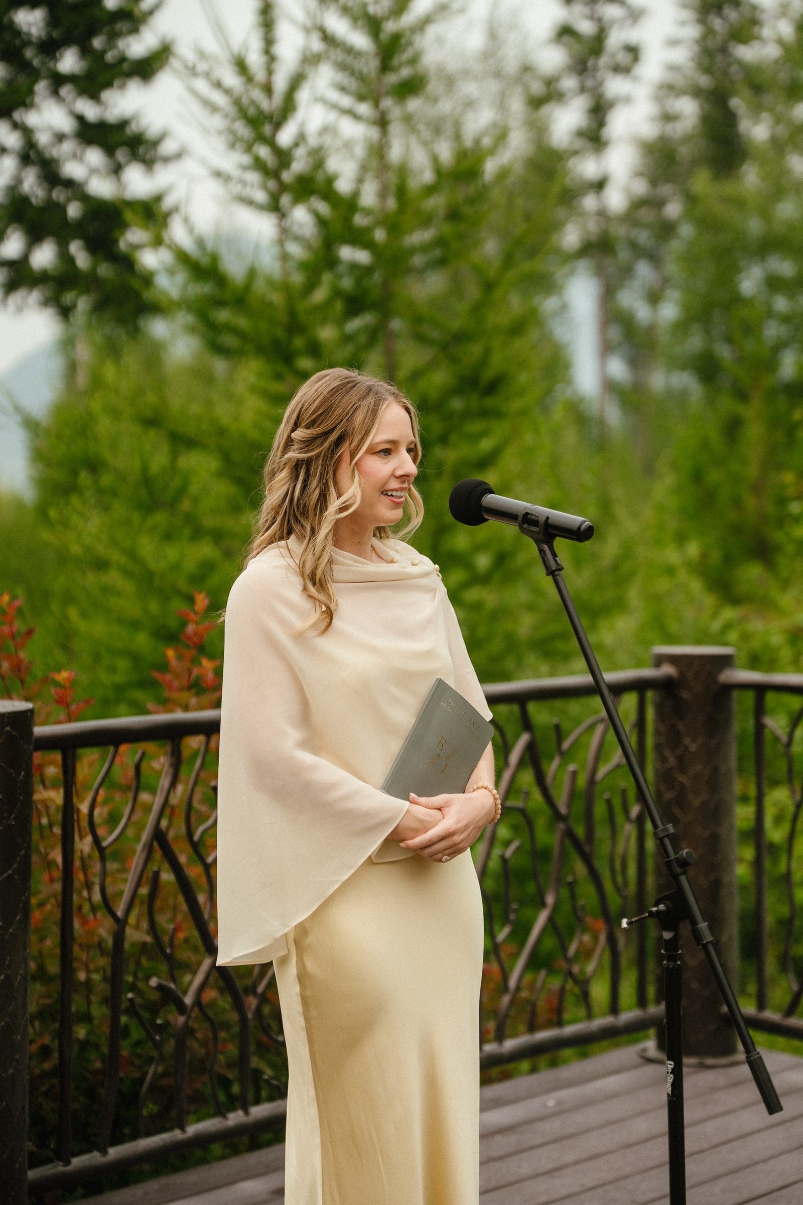 The officiant at the lakeside ceremony deck