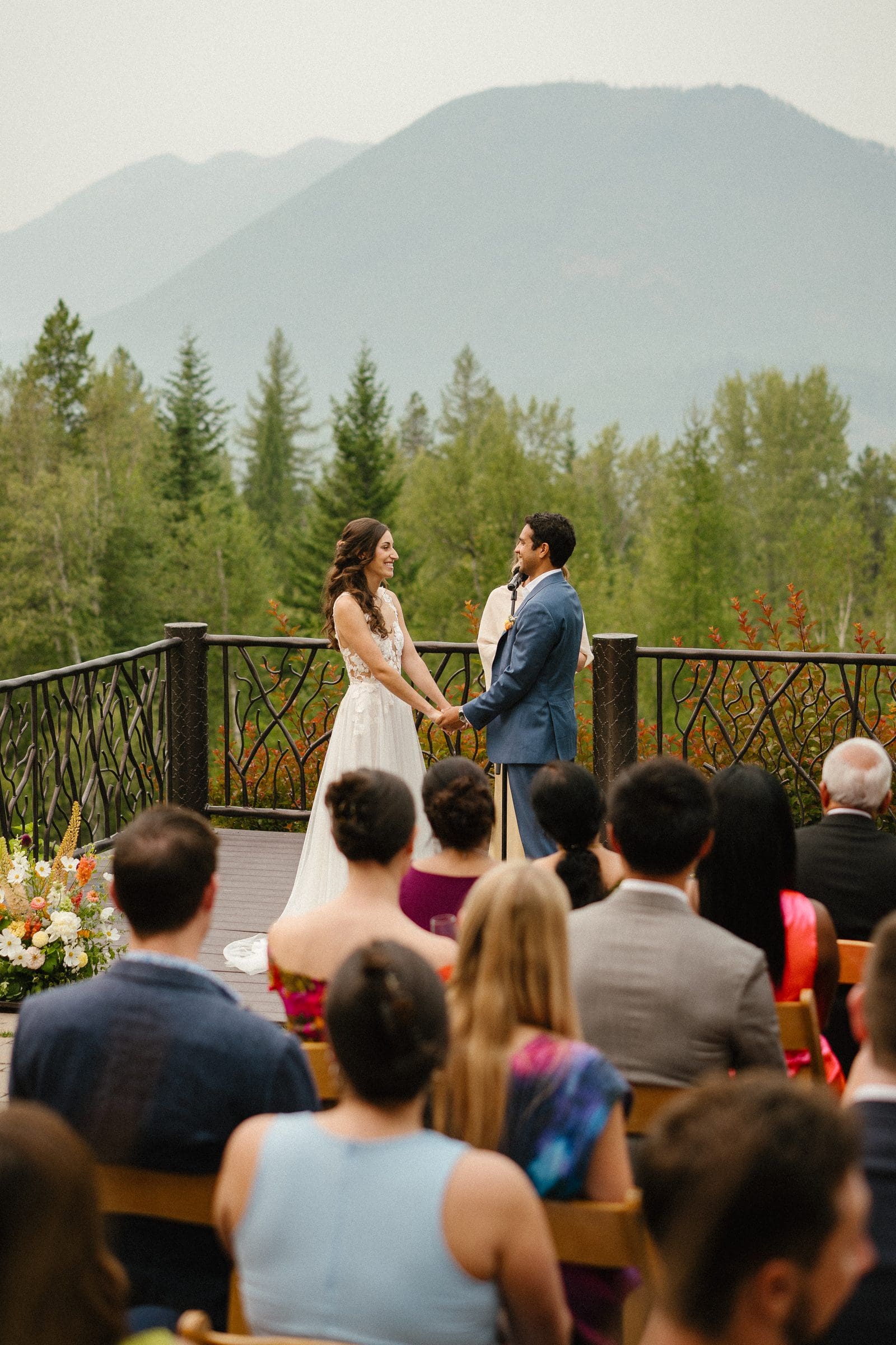 Guests watching Raj and Isabelle's ceremony with the mountains behind