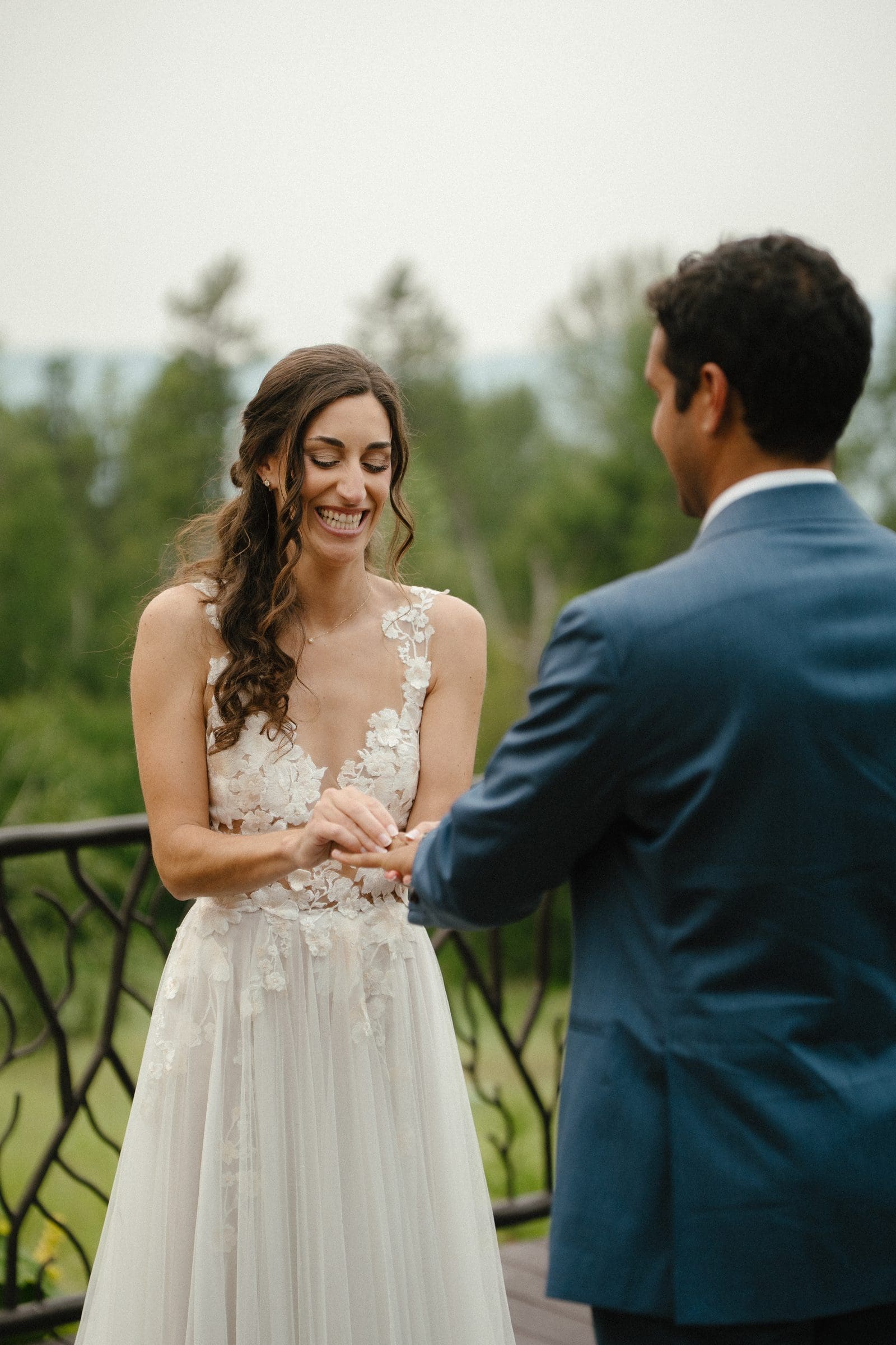 Raj placing the ring on Isabelle's finger
