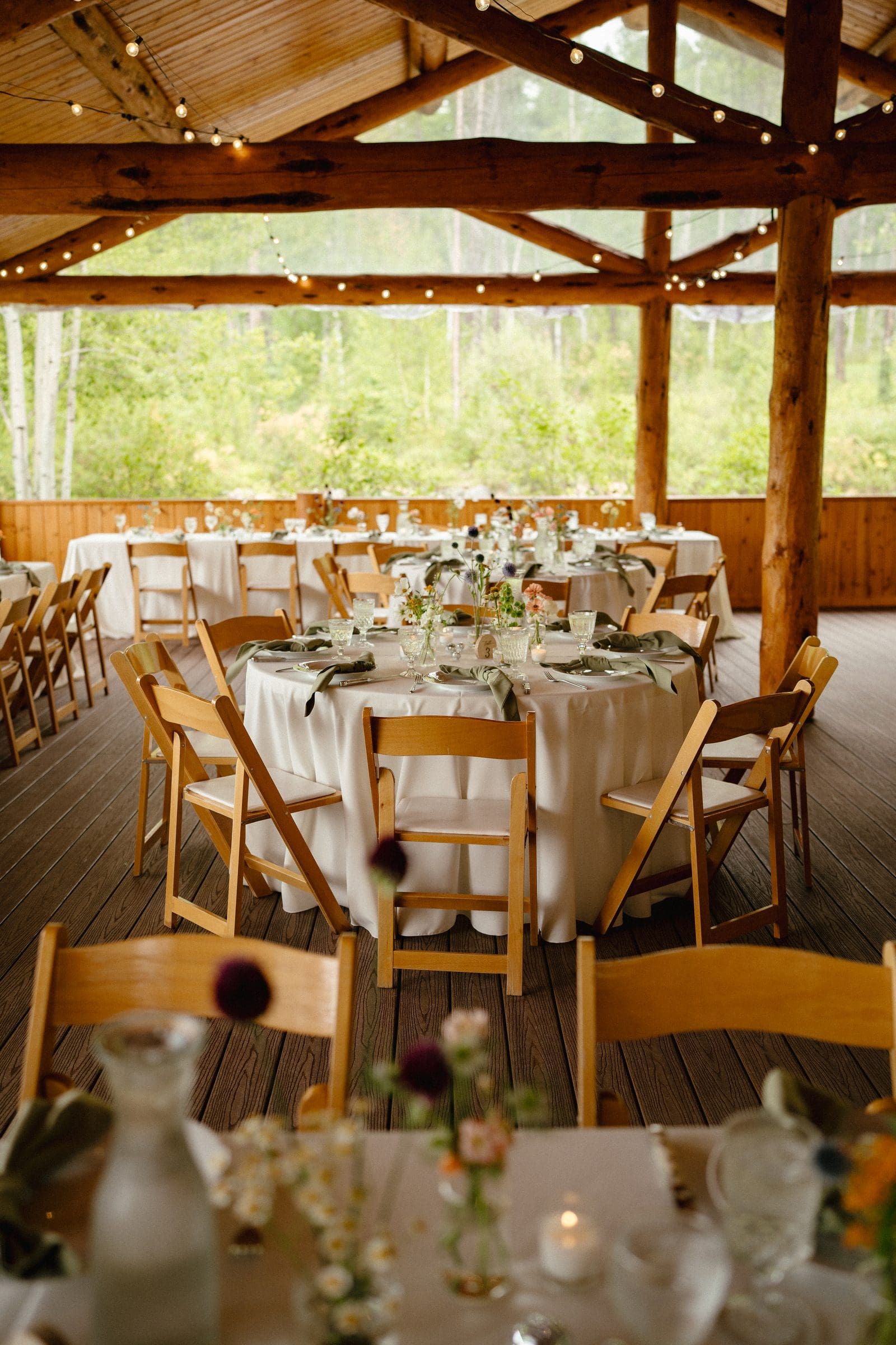Reception tables set inside the timber pavilion