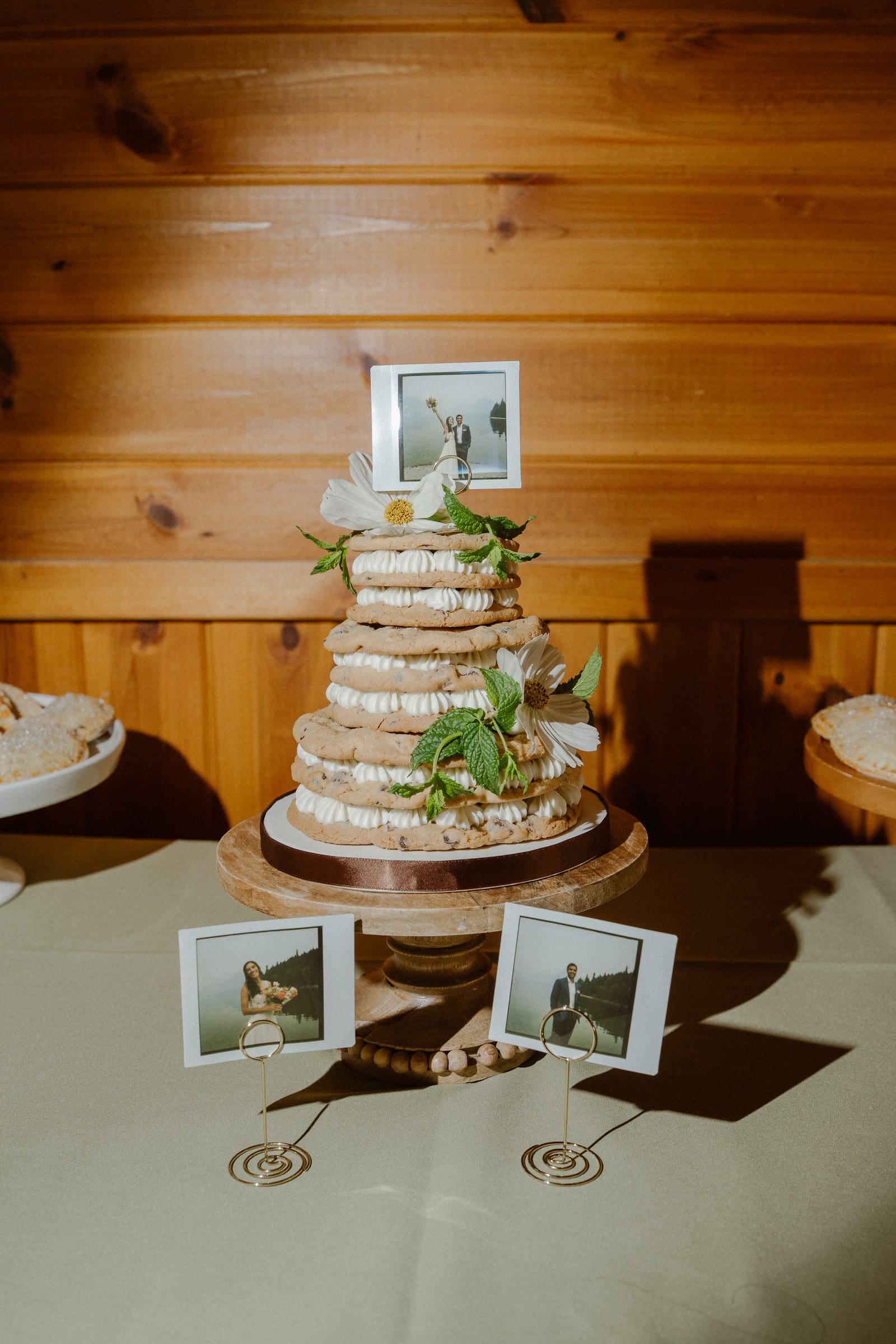Wedding cake with framed photos in the pavilion