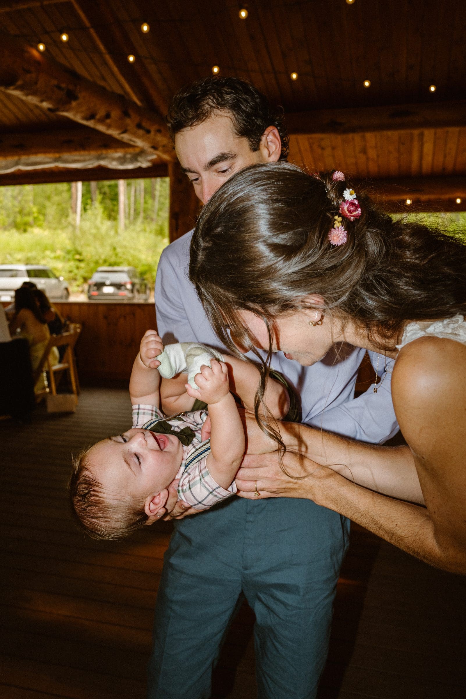 Isabelle playing with a little one at the reception