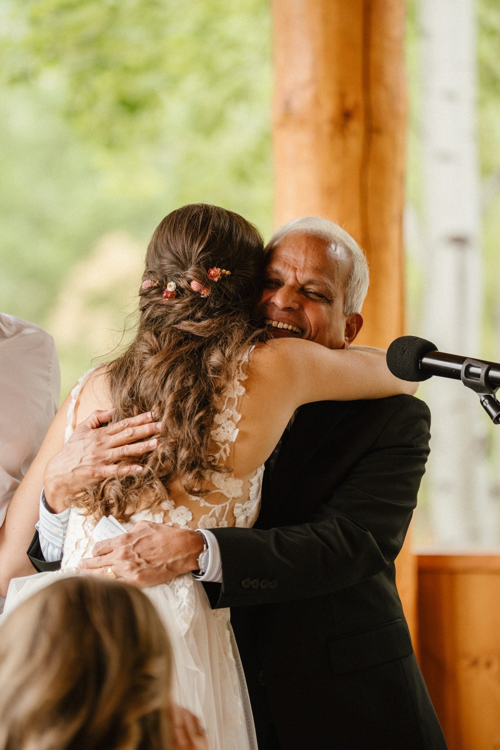 Isabelle hugging a guest after a toast