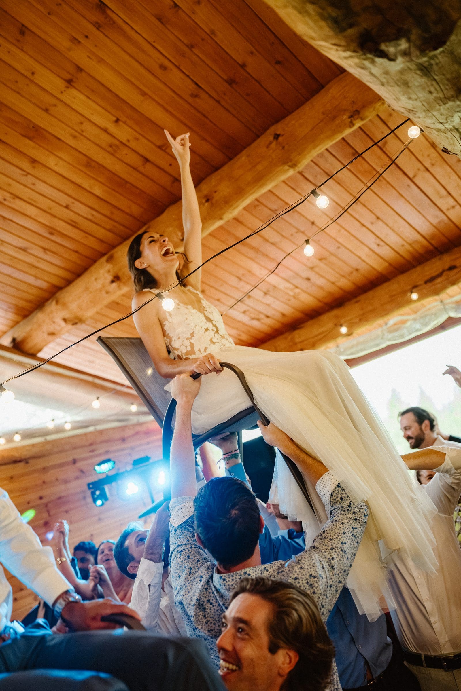 Isabelle lifted on a chair during the reception