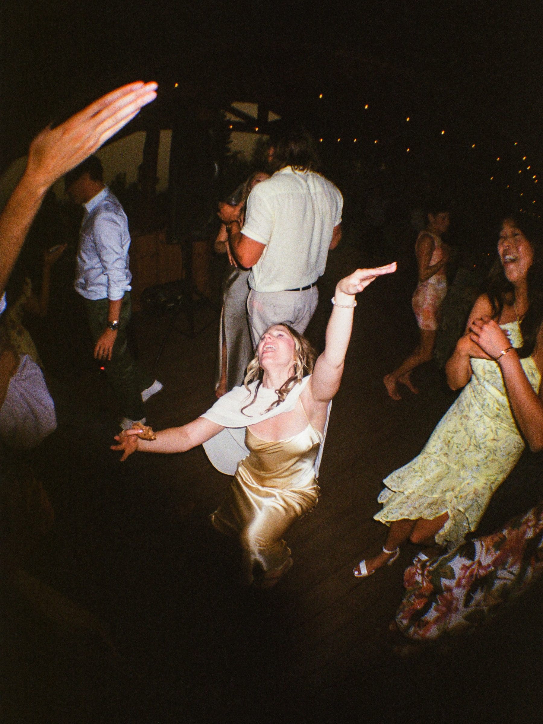 Guests dancing in flash at the reception, on film